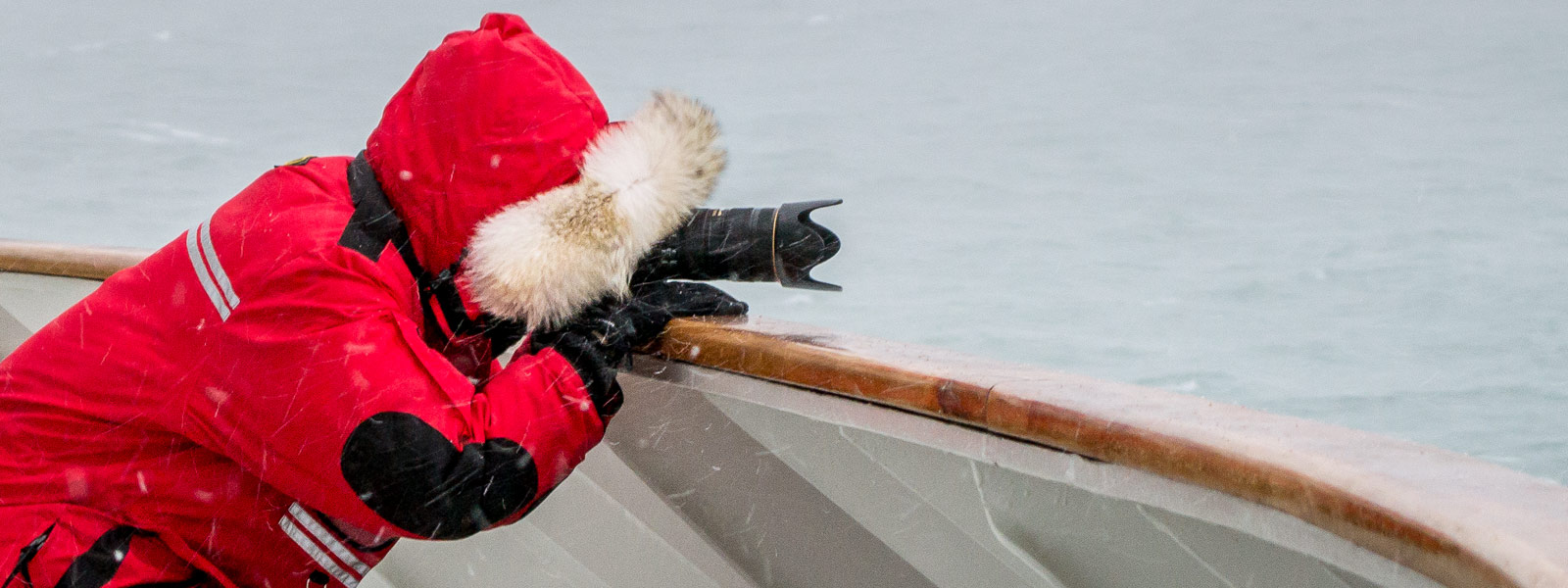 Me in a winter parka, making pictures on a Hurtigruten ship